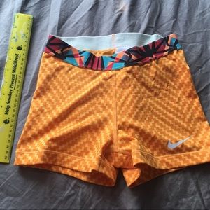Bright orange and multicolor nike athletic shorts